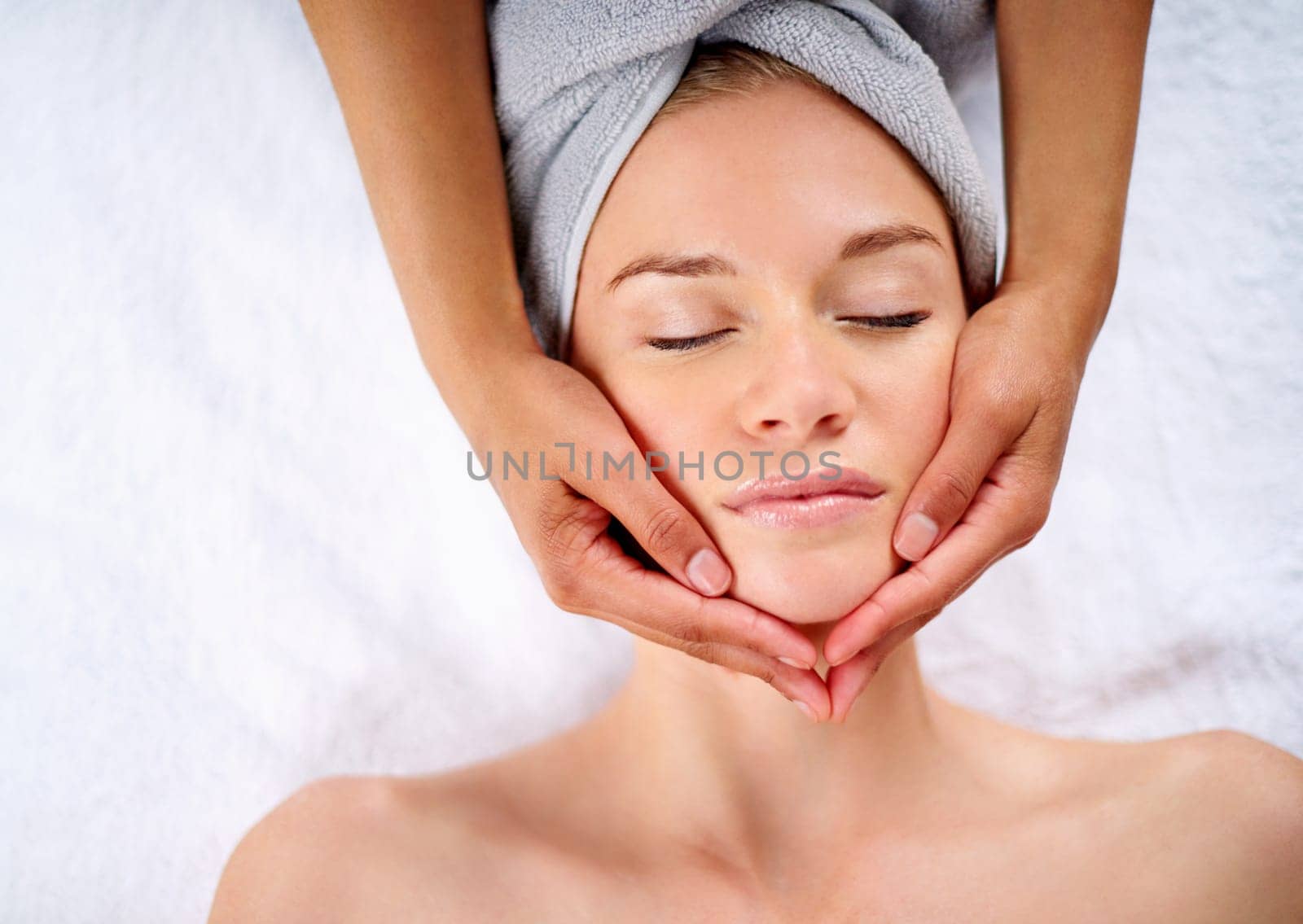 Woman, hands and facial massage or pamper treatment, cosmetics and beauty therapy. Female person, masseuse and serene or dermatology, skin care detox and above at spa for peace or zen and healing.