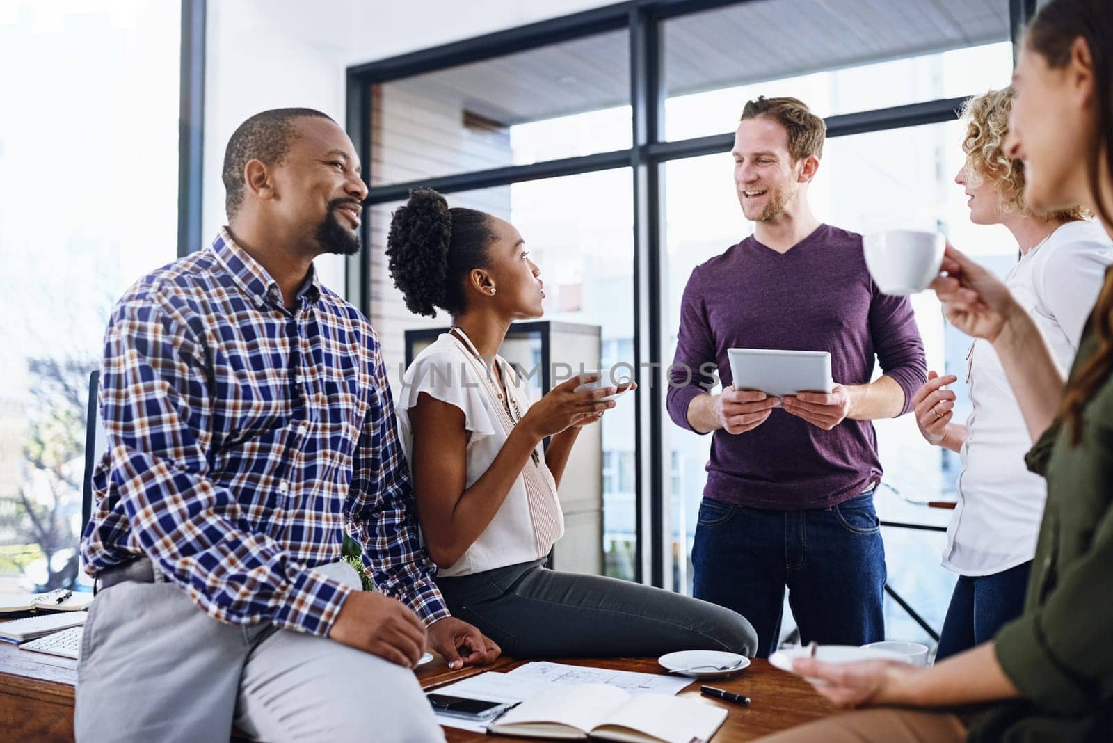 Office, meeting and business people on tablet for planning, discussion and collaboration. Digital marketing, diversity and men and women on tech for online project, teamwork and brainstorming ideas.