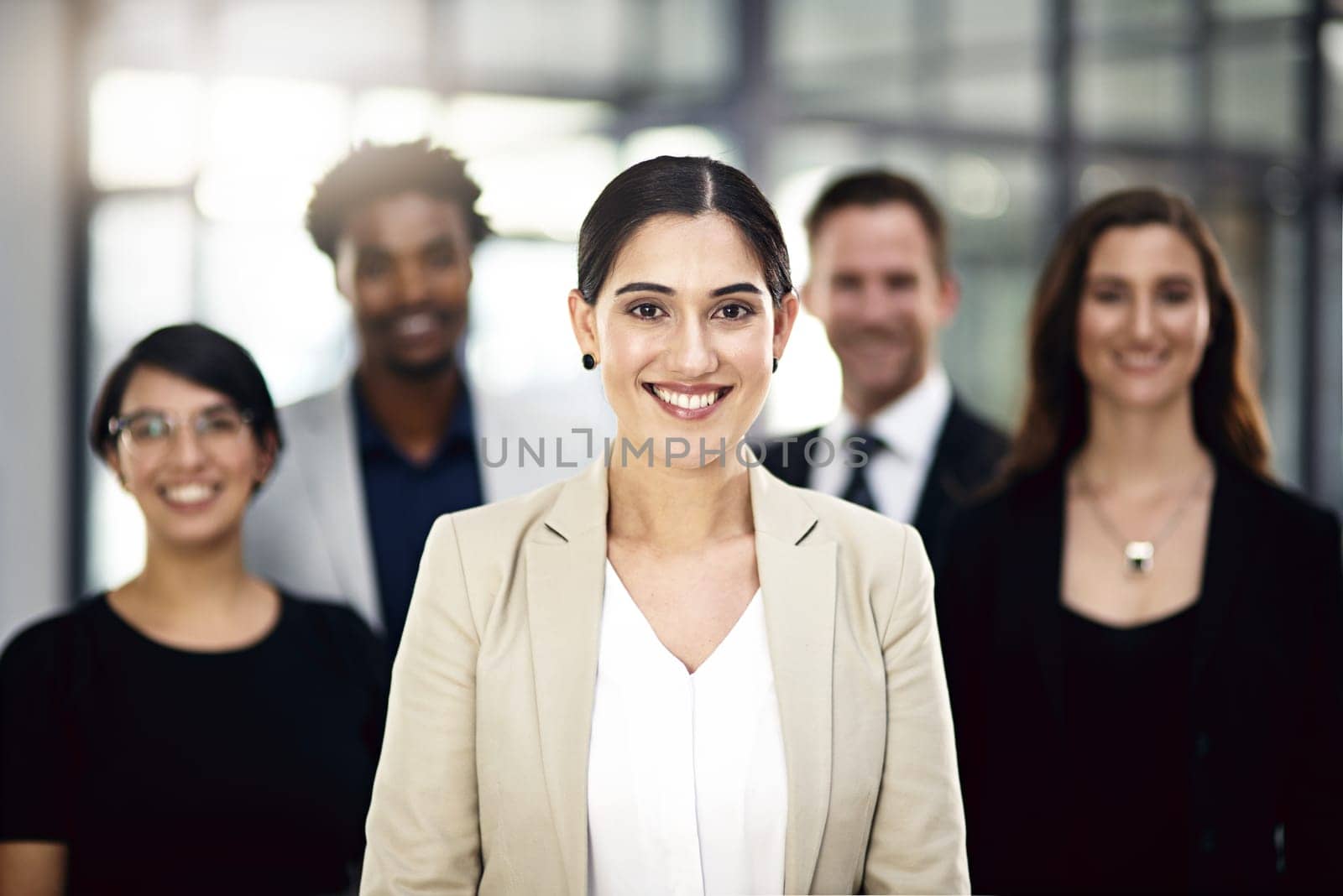 Teamwork, office and portrait of woman with business people for partnership, collaboration and about us. Professional lawyers, diversity and men and women with confidence, company pride and smile.