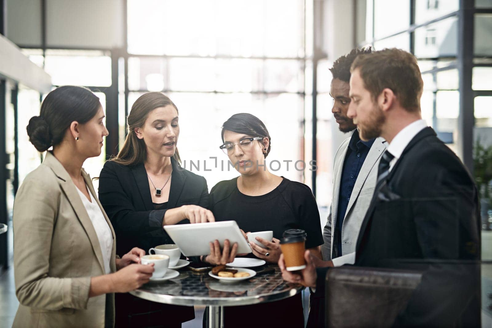 Business, team and discussion with tablet in office for collaboration or partnership on company project for growth strategy. People, diversity and digital technology for online feedback of website