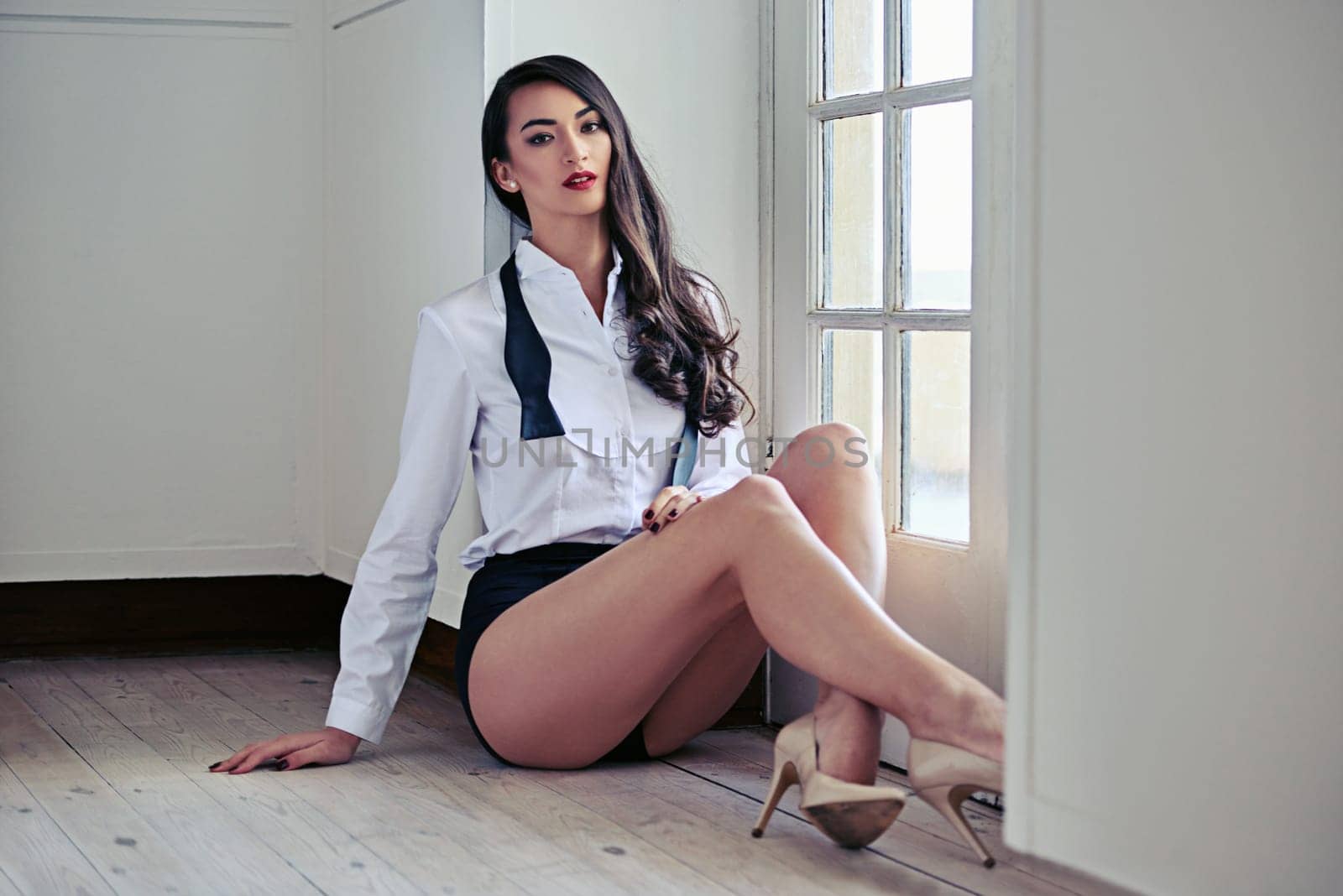 Asian woman, portrait and edgy fashion with confidence at window on floor with suit bowtie, high heels or underwear. Female person, face and stylish modeling with attitude or shirt, cool or sitting.