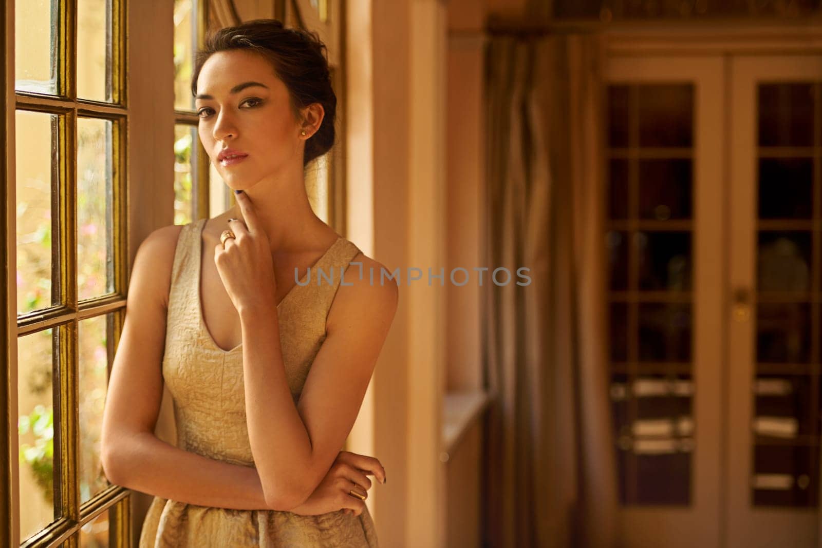 Fashion, beauty and portrait of woman in elegant home in style, classy outfit and formal clothes. Window, aesthetic and person with confidence, pride and luxury in vintage manor, house and mansion by YuriArcurs