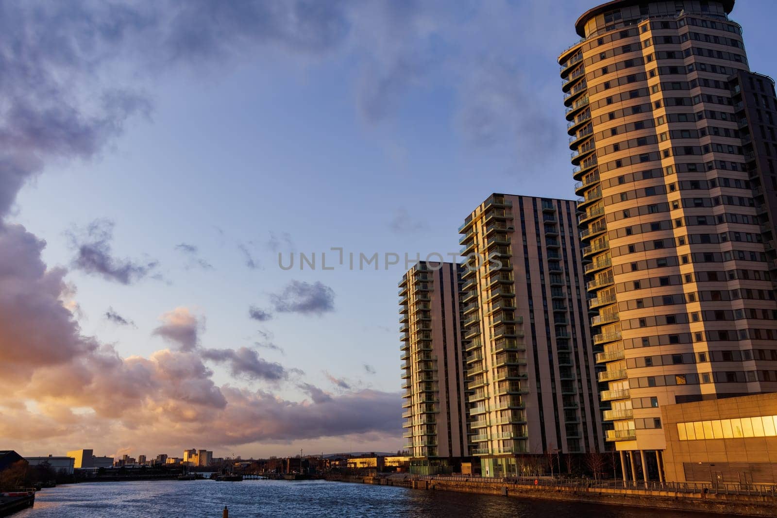 Manchester, UK - February 20 2020: The Lightbox and The Heart apartment blocks across Salford Quays in MediaCity.