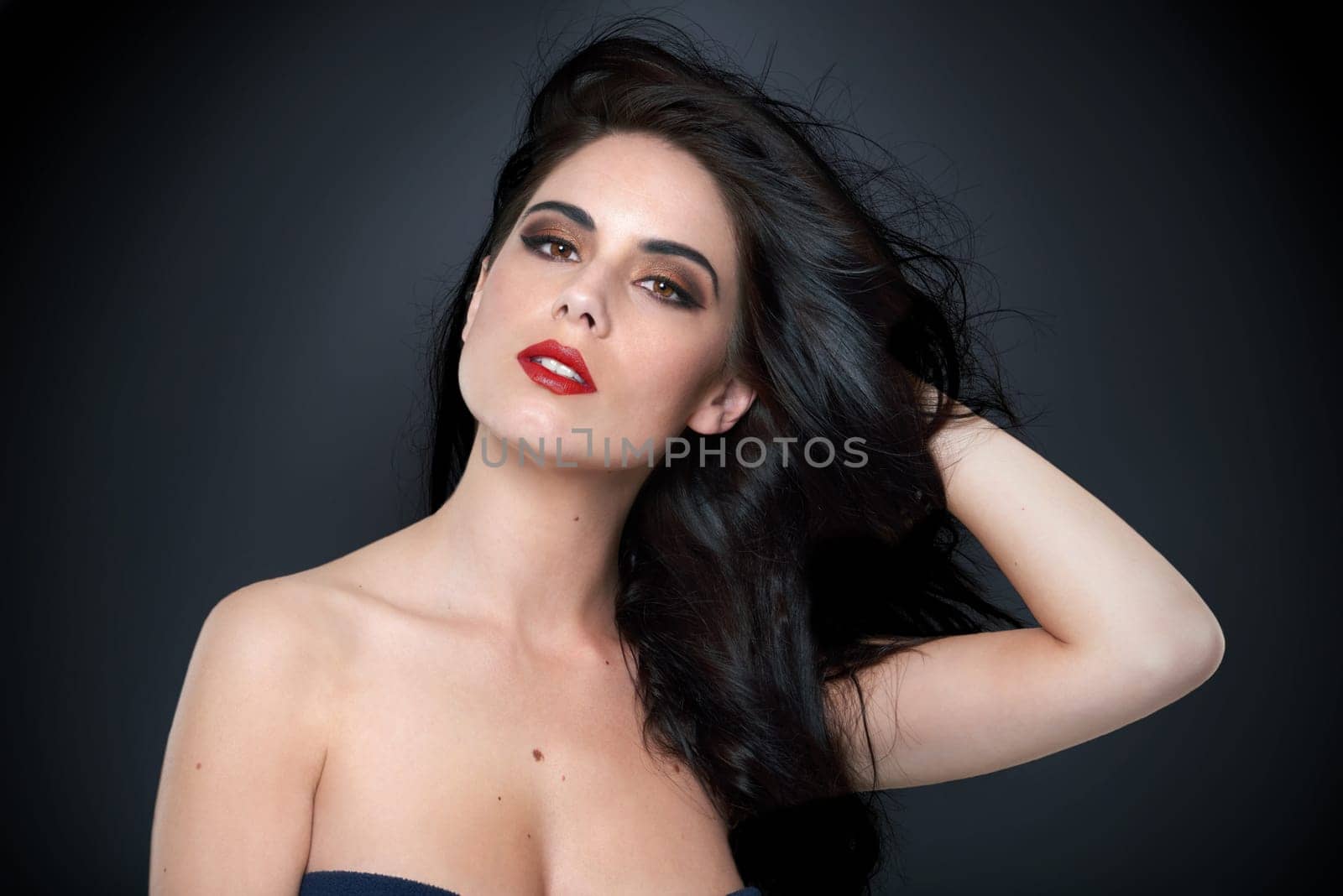 Fashion, beauty and portrait of woman on black background with glamour, cosmetology and skincare. Aesthetic, attractive model and confident person with makeup, cosmetics and hairstyle in studio by YuriArcurs