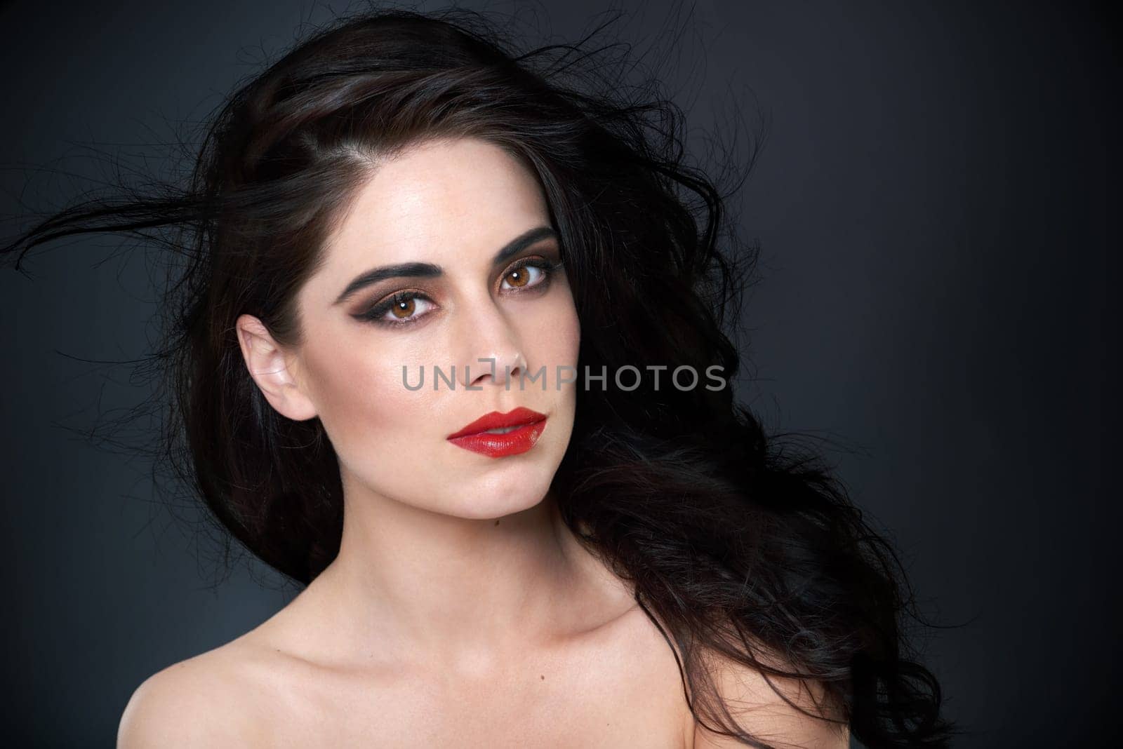 Beauty, makeup and portrait of woman in studio for skincare, wellness and glamour. Cosmetology, aesthetic and face of confident person with red lipstick, cosmetics and salon care on black background.