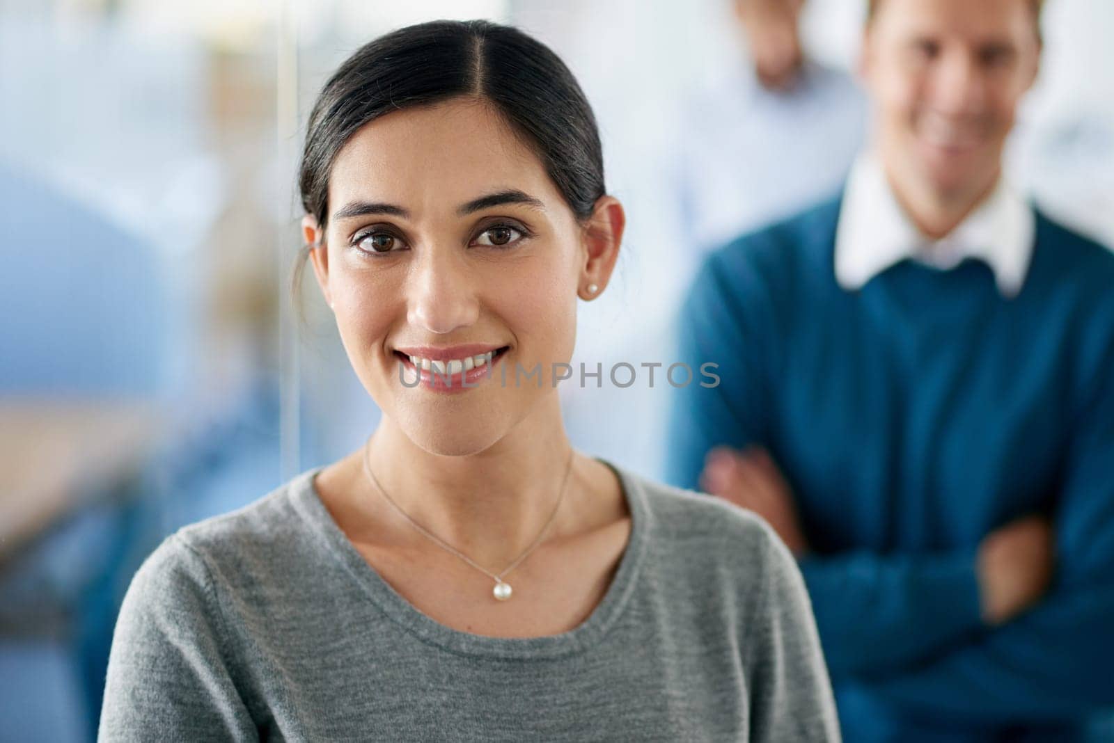 Portrait, Indian woman and happy as employee in office for career or job growth with opportunity. Female person, smile and confident with pride as graphic designer in startup company or business by YuriArcurs