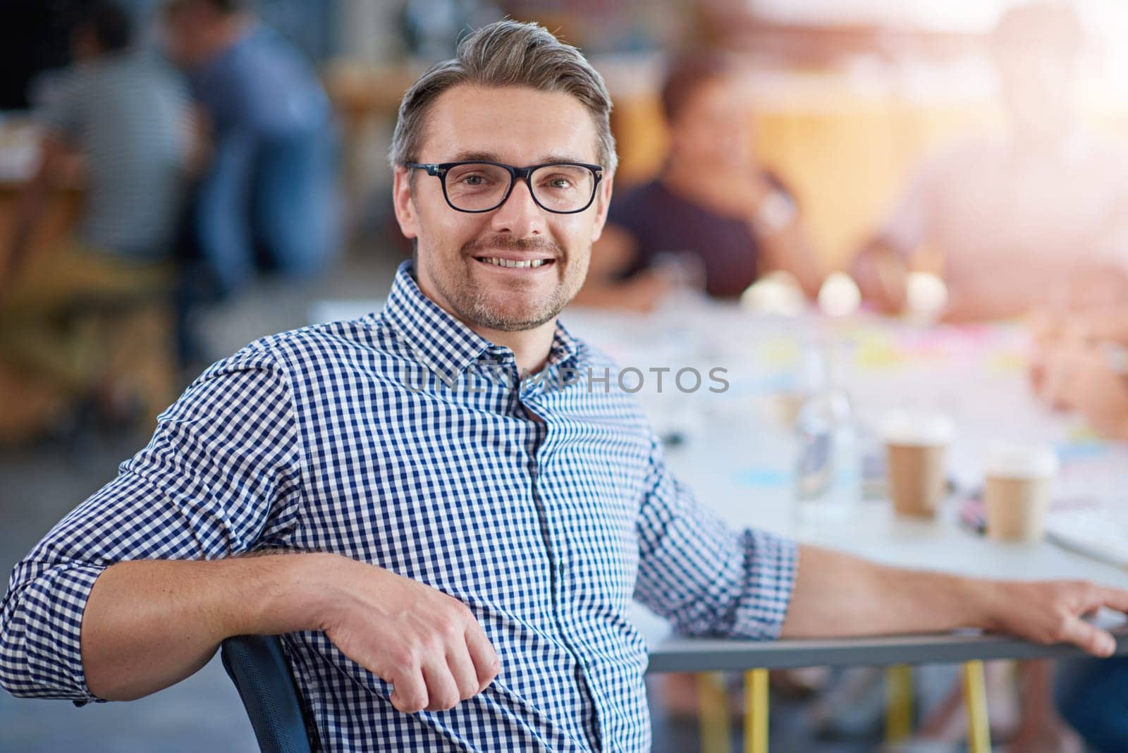 Man, portrait and office for meeting, planning and teamwork for creative startup with collaboration. Businessman, colleagues and web designer with glasses, confidence and growth or development.