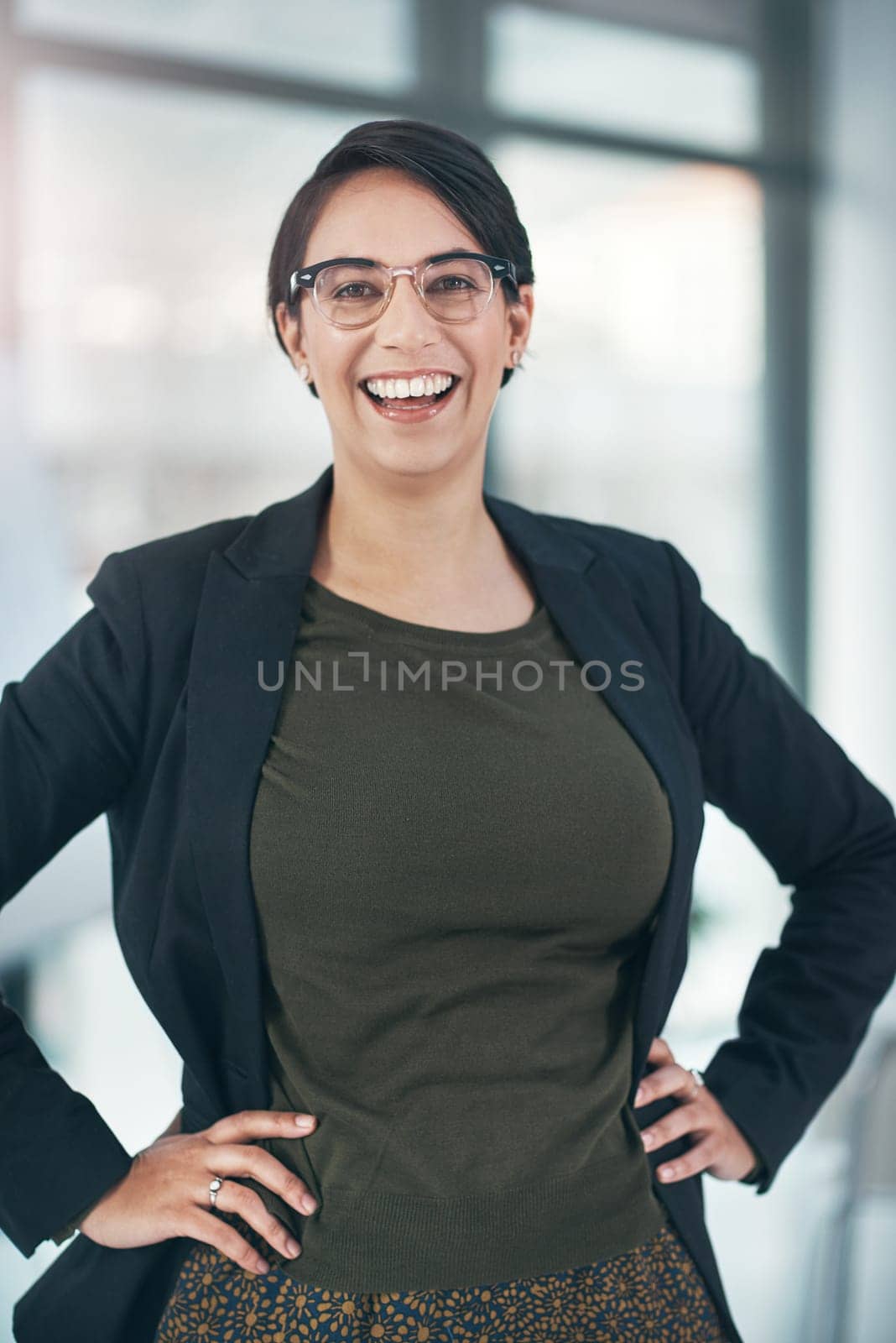 Business woman, laughing and portrait in office with career confidence, startup and about us in human resources. Excited employee, person or young worker with job integrity, vision and successful.