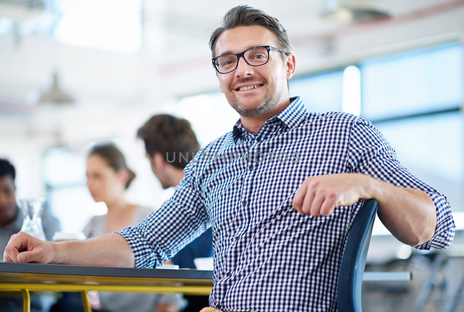 Businessman, portrait and office for meeting, teamwork and planning for creative startup with collaboration. Man, colleagues and web designer with glasses, confidence and growth or development by YuriArcurs