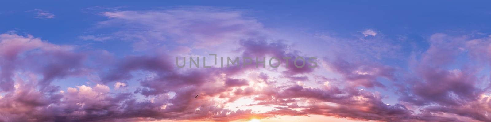 Dramatic Sunset sky 360 panorama. Vibrant sky with bright glowing red pink Cumulus clouds. HDR 360 seamless spherical panorama. Sky dome for aerial drone panoramas. Climate and weather change