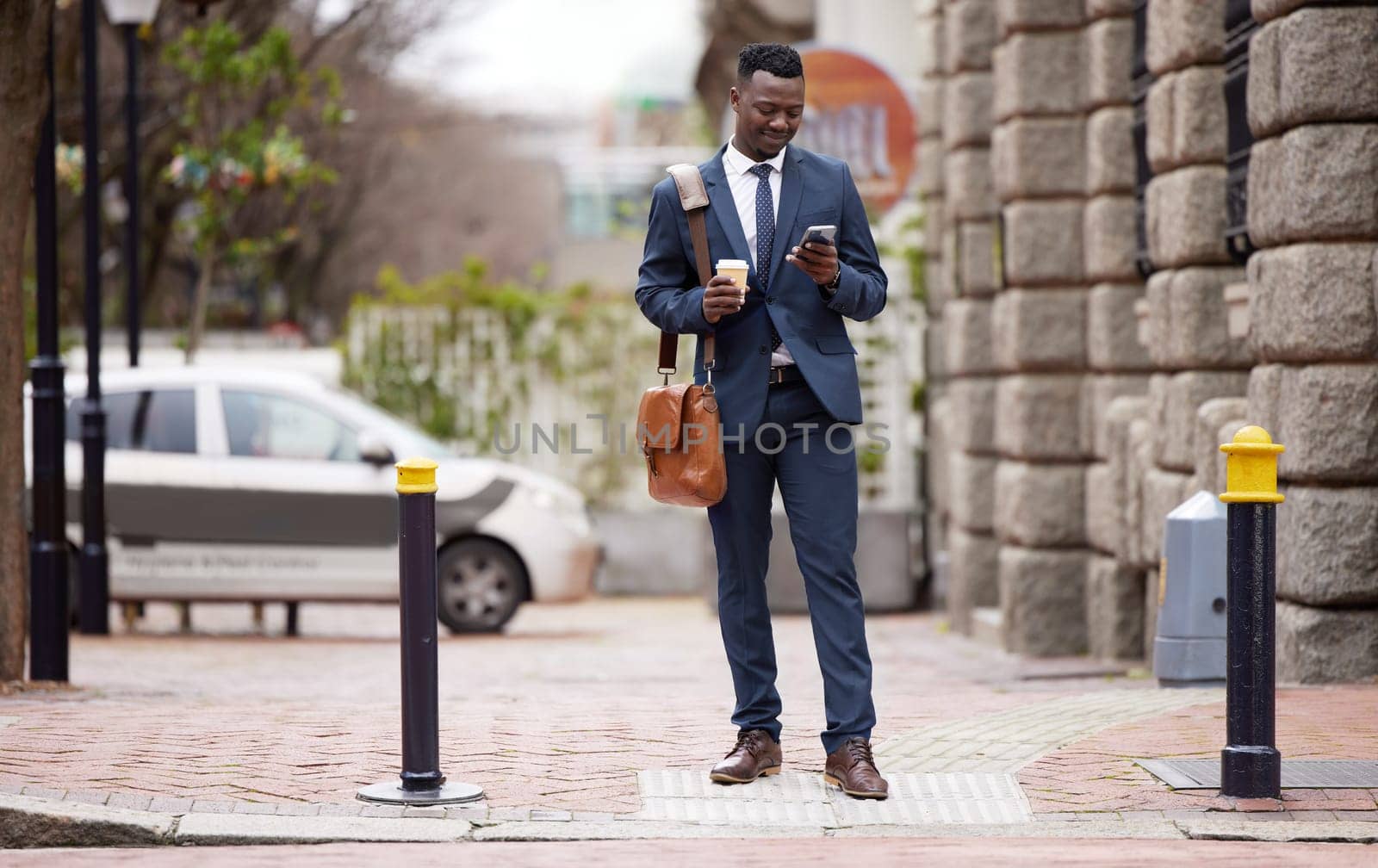 Cell phone, walk and black man in city for work commute, social media and networking in town. Travel, professional and male worked in road with coffee, smartphone and internet for texting and email.
