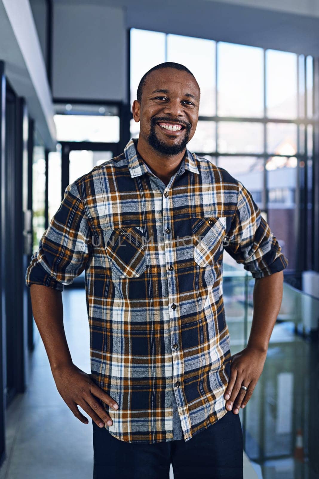 Black man, office and portrait with happy, smile and confidence from design work and job. Architect, entrepreneur and proud professional at an architecture company ready for working at a startup by YuriArcurs