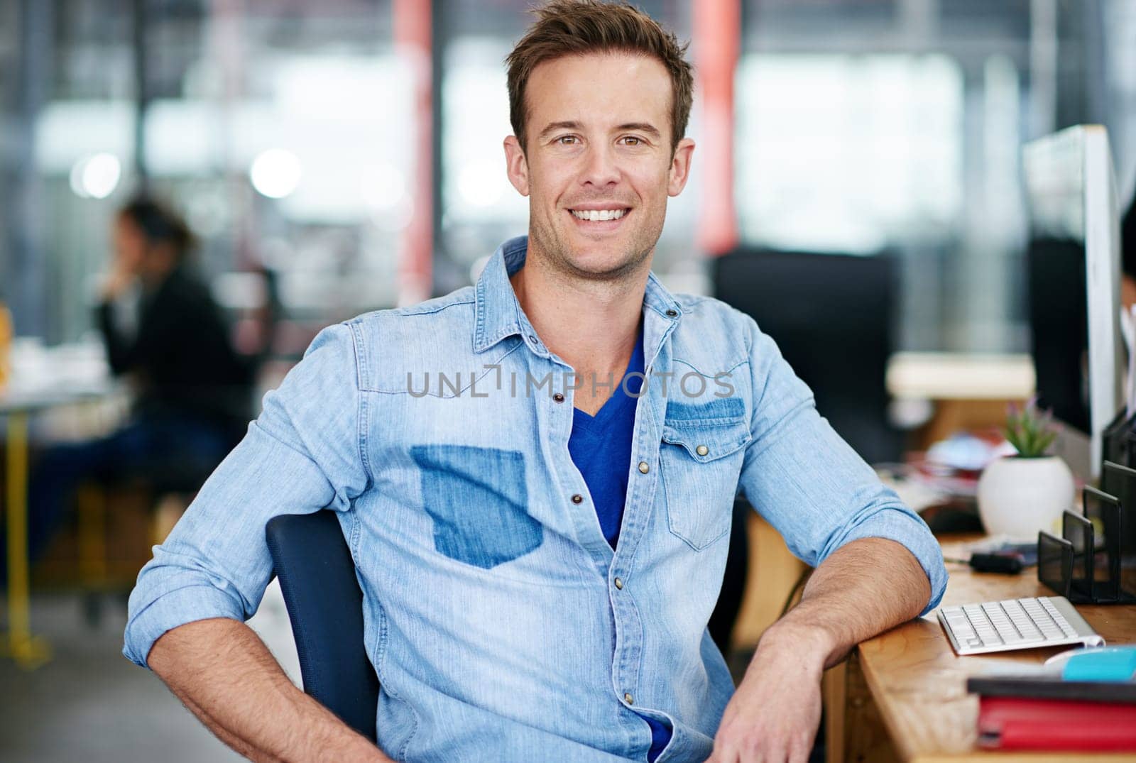 Portrait, happy and business man in office at startup, company or workplace for career in Germany. Professional, creative entrepreneur and smile of confident employee, worker or designer at desk job.