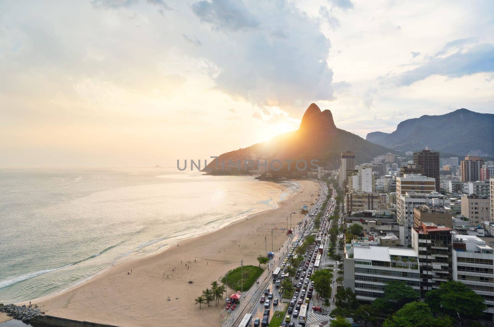 Drone, beach and city with sunshine, nature and travel with Rio de Janeiro, Brazil and vacation. Getaway trip, aerial view and outdoor with mountains, seaside and sand with buildings and vacation by YuriArcurs