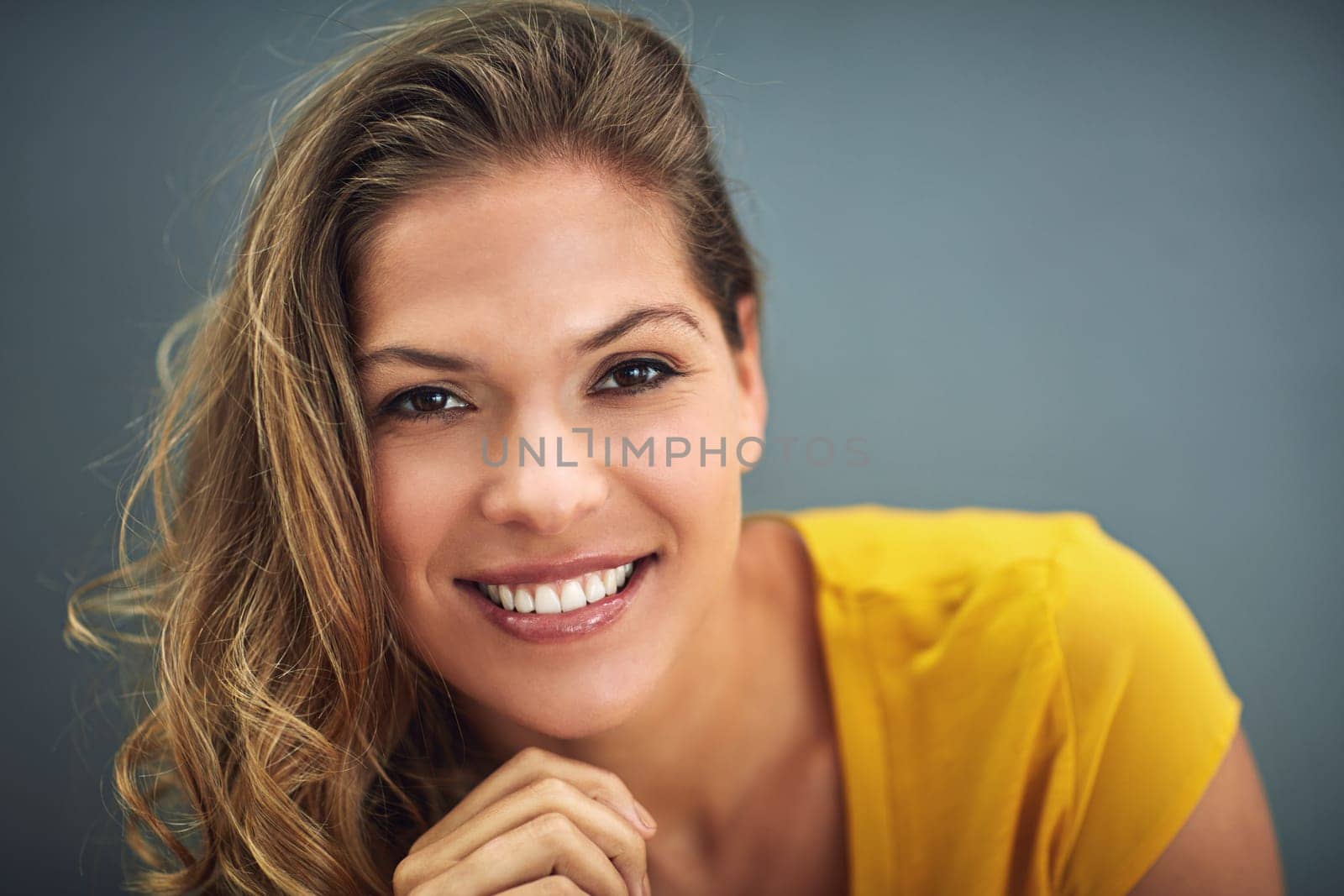 Hair care, smile and portrait of woman in studio for shampoo shine, luxury salon or treatment. Female person, happy and face with pride for keratin growth, hairdresser or cosmetics on gray background by YuriArcurs