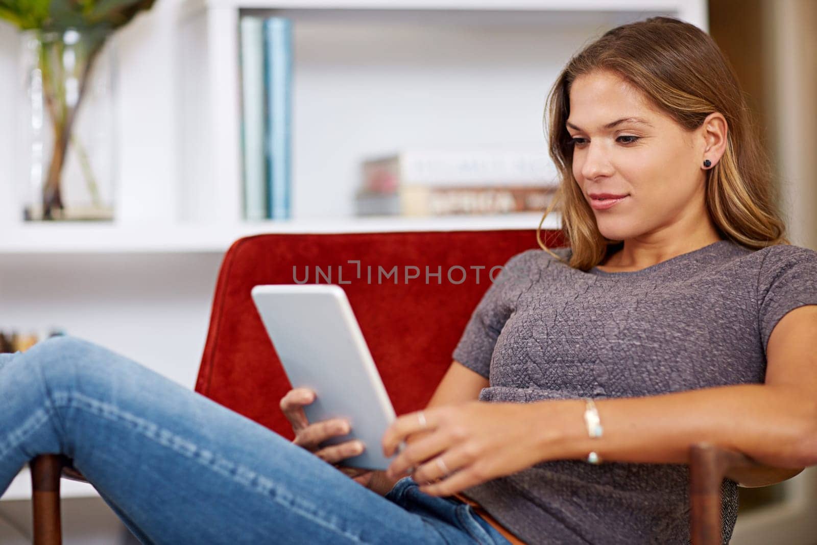 Movie, streaming or woman on tablet in house to relax with internet connection for film, video or research online. Smile, blog and happy girl on social media and technology for subscription in home.