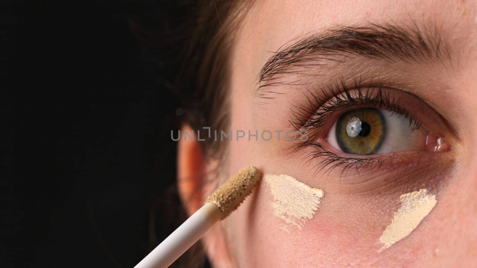 Girl Applying Concealer Under Eyes, Makeup Foundation For Eyelids Close Up Shoot by GekaSkr