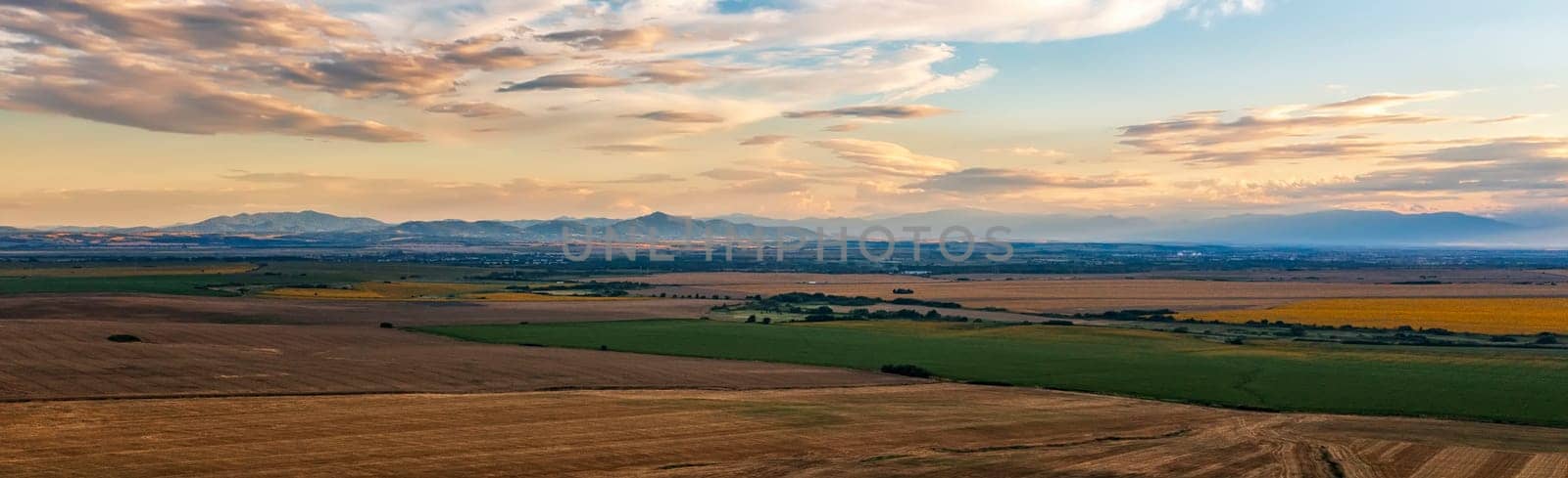 Stunning aerial panorama of beautiful autumn fields , and colorful sunset sky