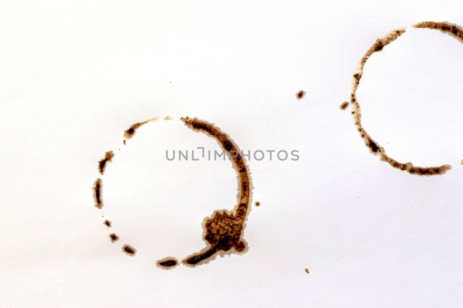 Cup ring splashes and circle drink marks. Brown dirty mug stains. Coffee grunge texture