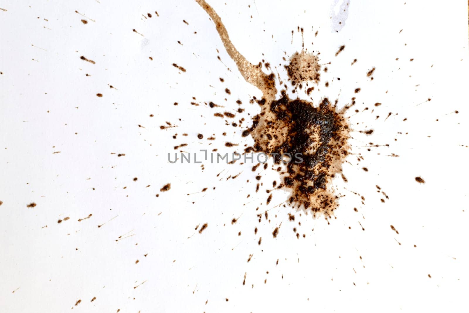 Coffee drops splashes with a brown color texture isolated on a white background