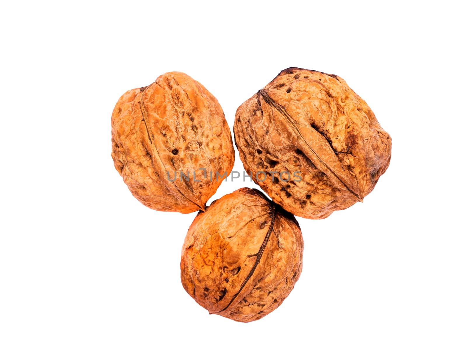 Top view of three walnuts, isolated on a white background