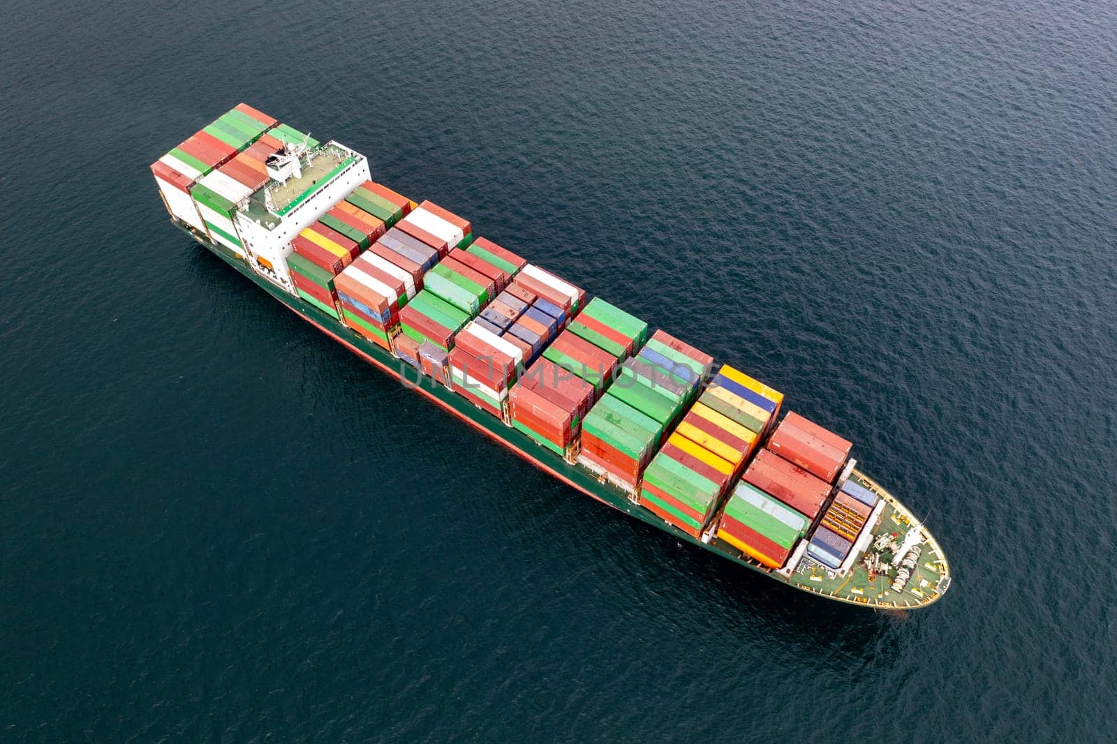 Aerial view of a container cargo ship on the sea. Cargo and shipping logistics business