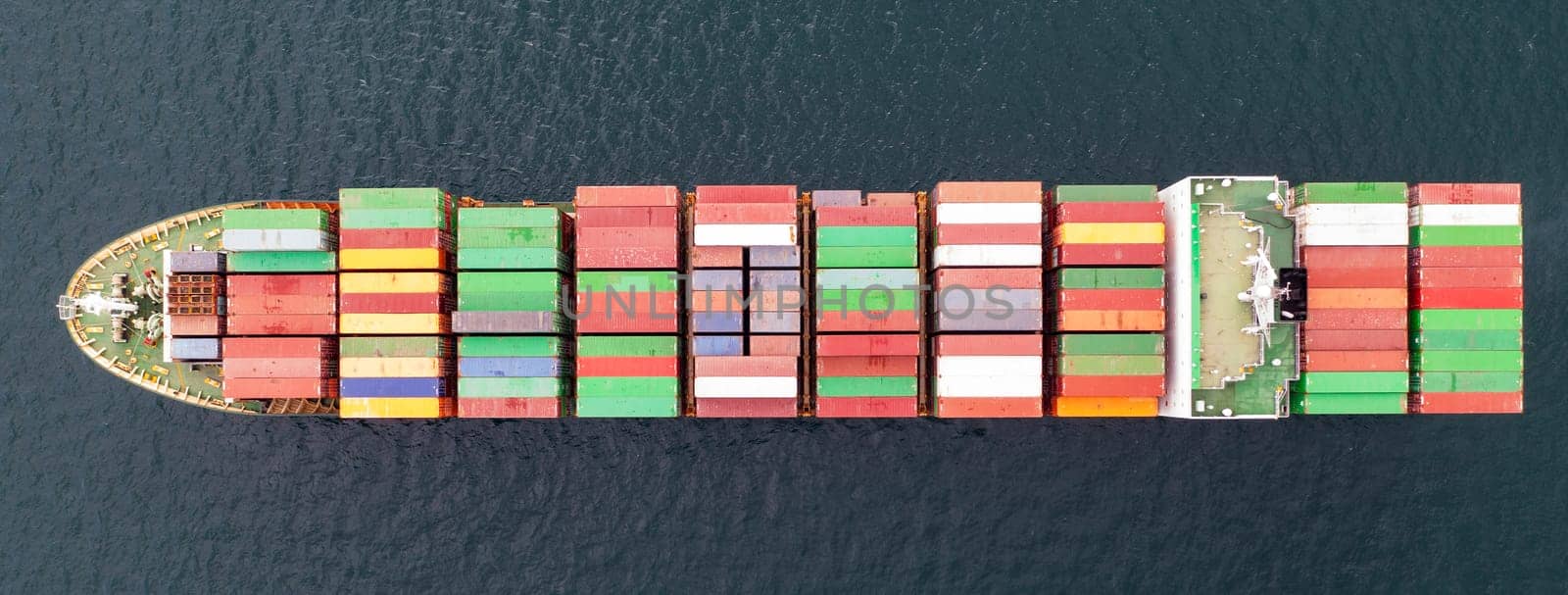 Aerial view of a container cargo ship on the sea. Cargo and shipping logistics business by EdVal