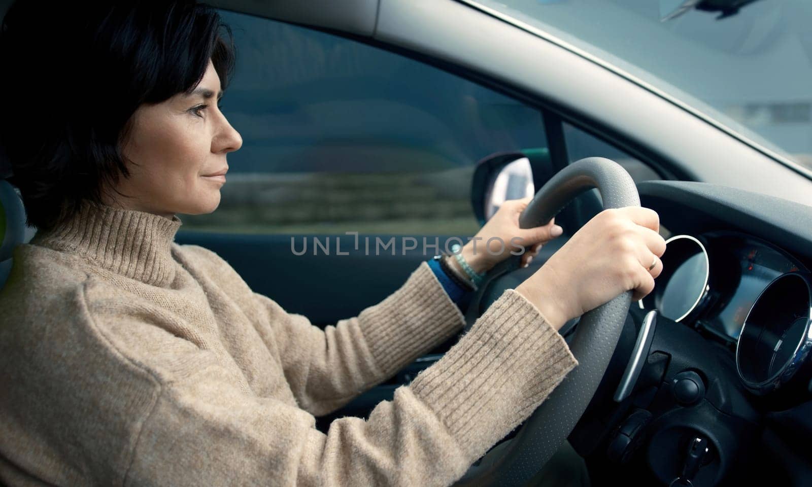 Woman Driving Her Car Through The Countryside