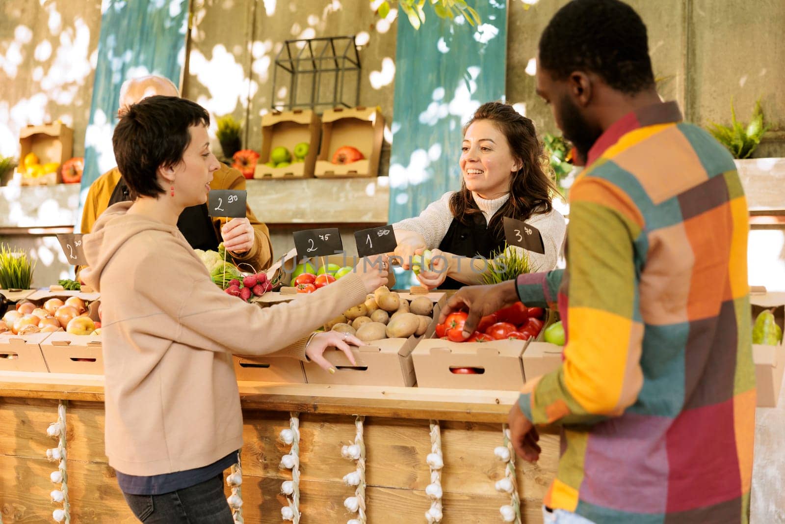 Female merchant offers apples for tasting by DCStudio