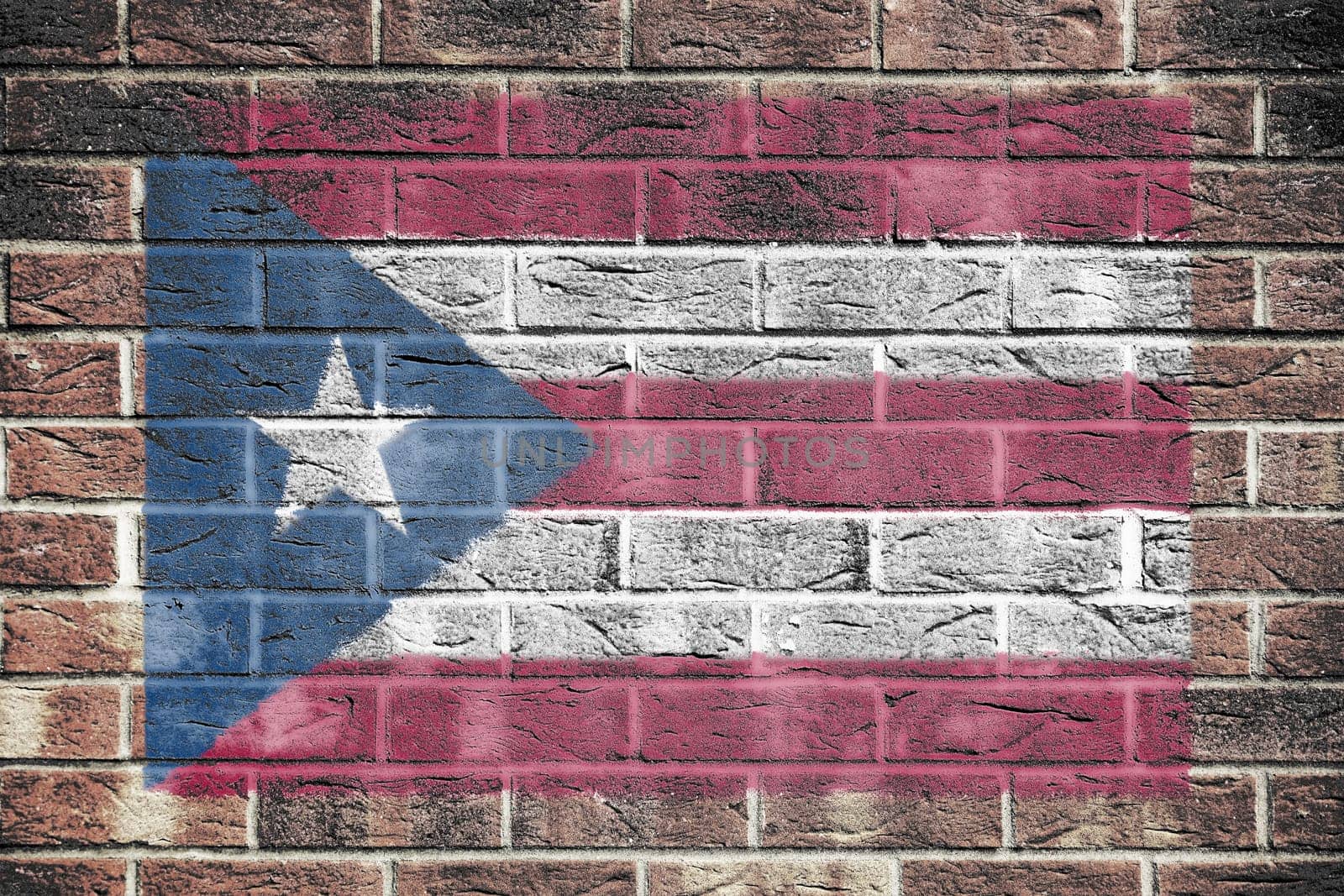 Puerto Rico flag on old brick wall background by VivacityImages