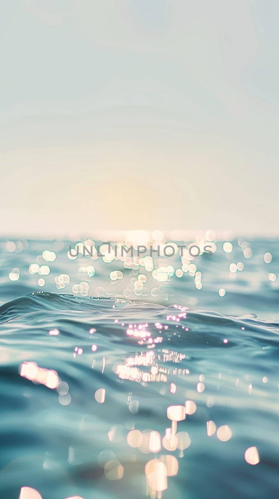 Sunlit ocean surface with sparkling bokeh effects