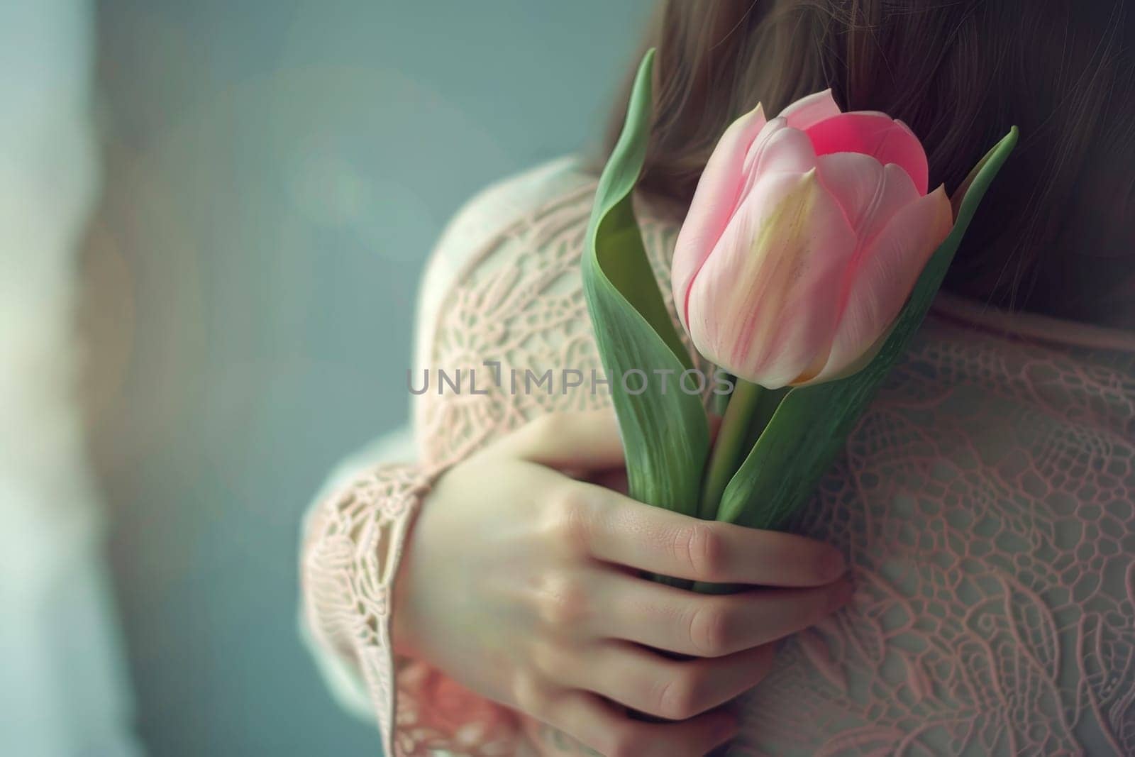 A woman is hugging a child and there are pink flowers in the background by matamnad