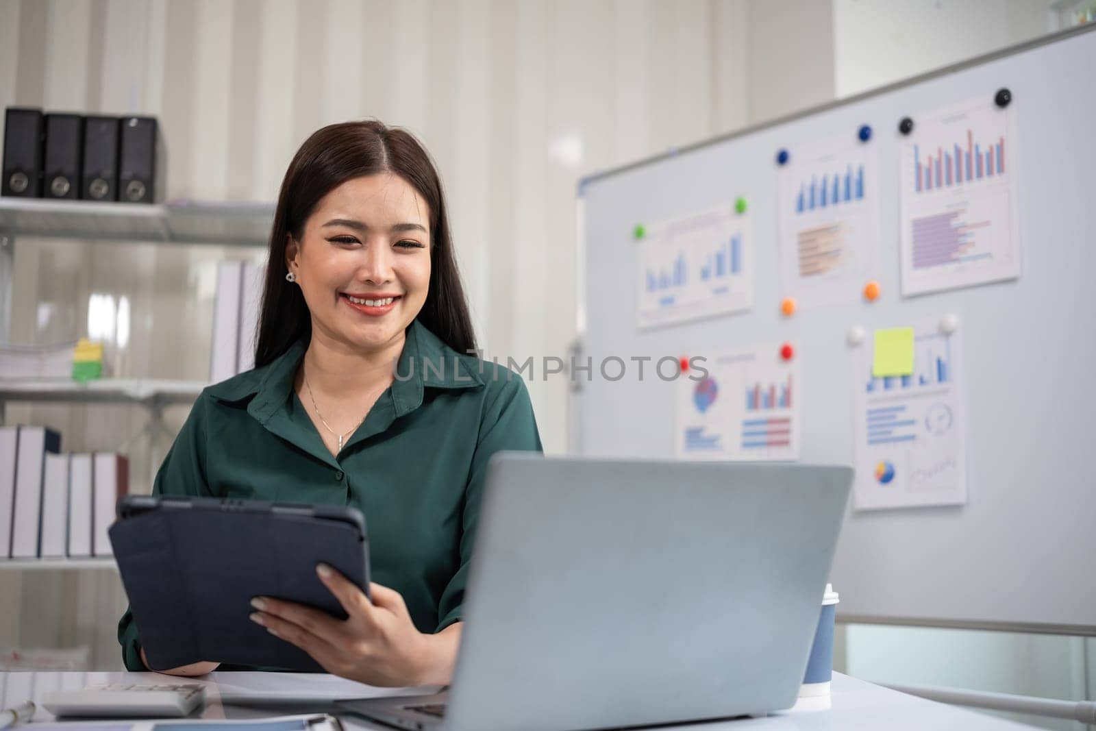 Beautiful business woman with determination Working on laptop in modern office.