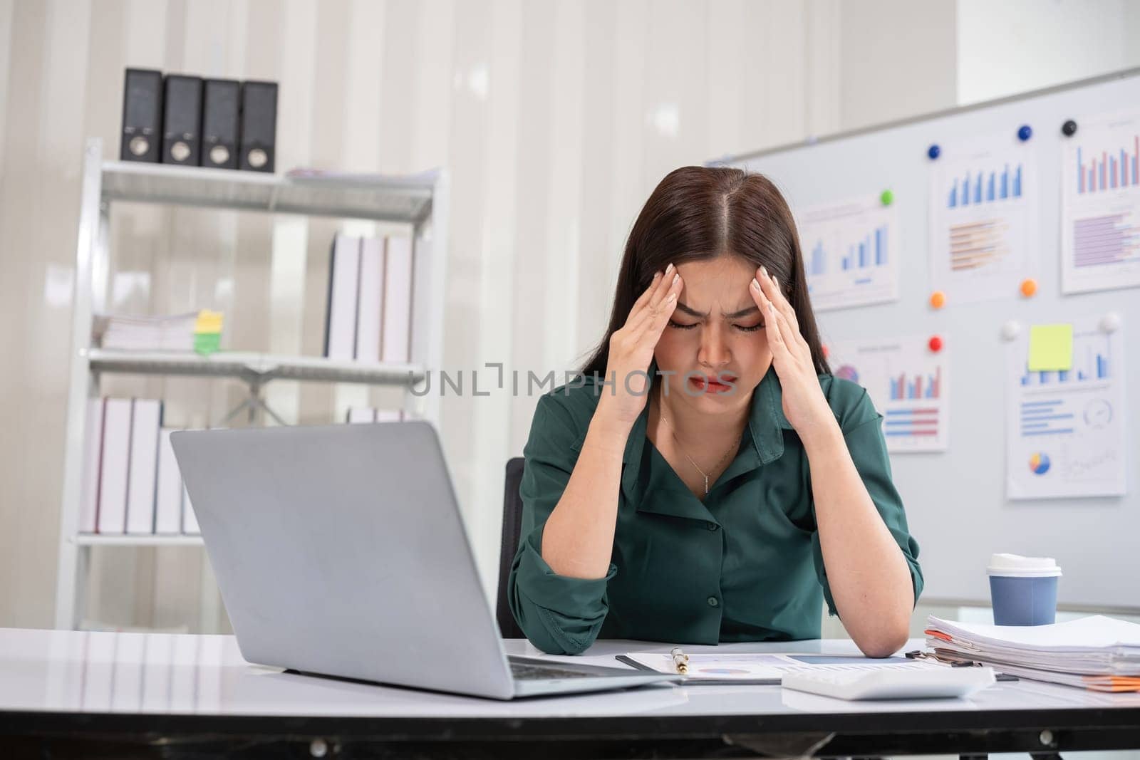 Young businesswoman is having problems with her work at work. Feeling stressed and unhappy because the results did not meet the goals.