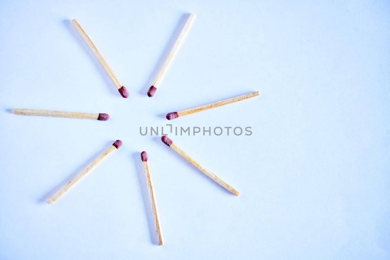 Match, sticks and wood or fire starter, circle and flammable product in studio isolated on background. Spark, burn and flame for light or smoke of tobacco, smoking tools and flat lay for ignite by YuriArcurs