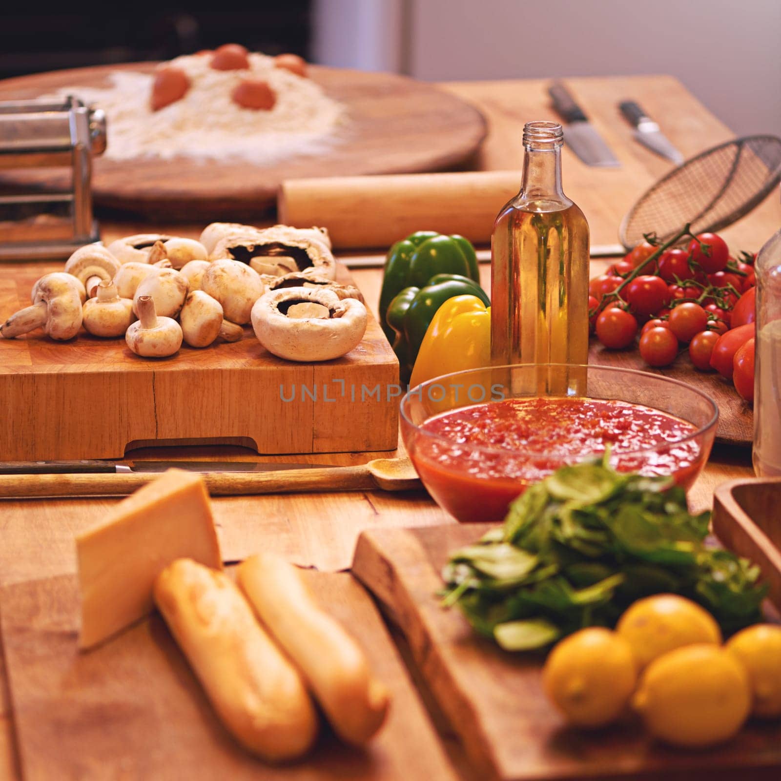 Cooking, pasta and vegetables in kitchen on table for meal prep for dinner, supper and lunch in home. Recipe, food and utensils on counter with ingredients for wellness, nutrition and healthy eating.