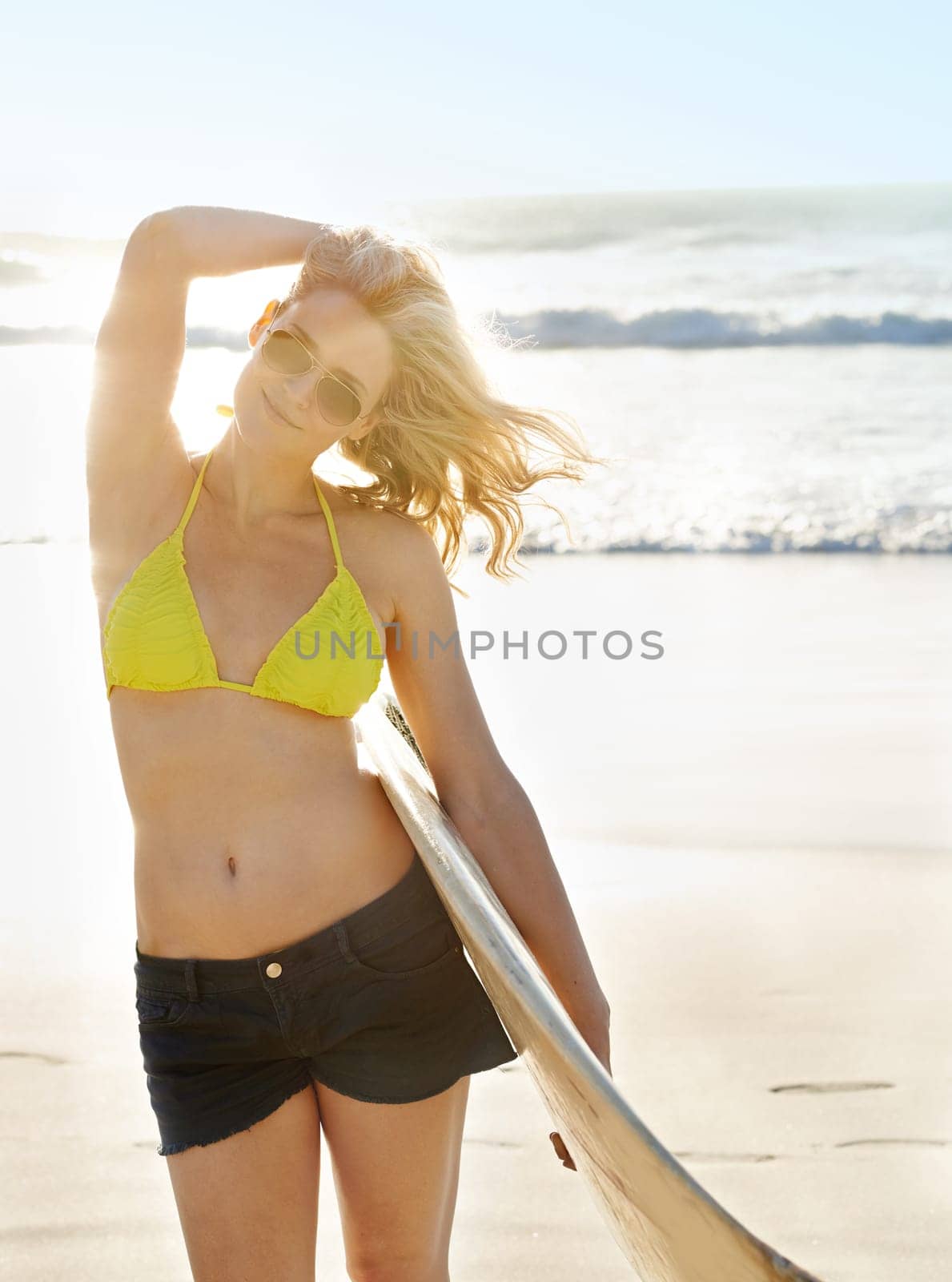Surfboard, sunglasses and woman by beach for vacation, adventure or holiday in Australia for travel. Happy, water sports and female surfer in bikini by ocean or sea for tropical island weekend trip