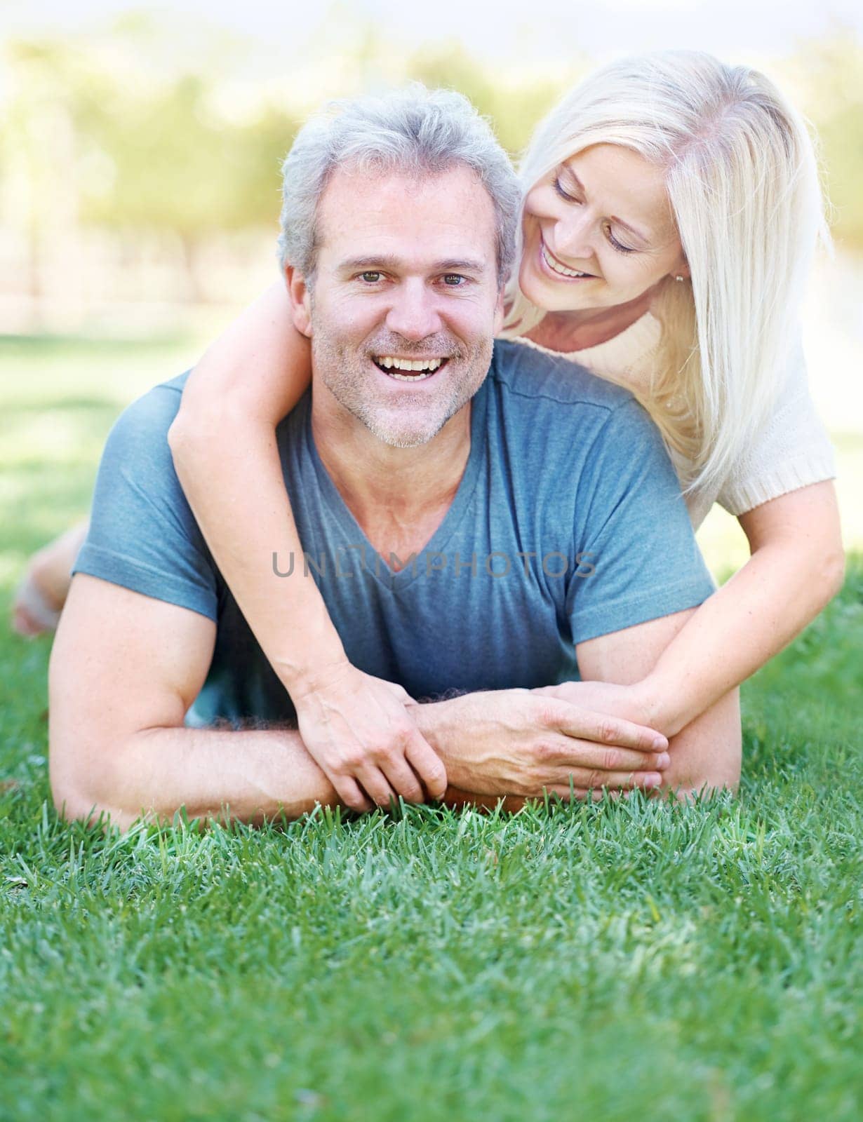 Happy, park and portrait of senior couple for bonding, relationship and commitment outdoors on grass. Love, retirement and mature man and woman embrace for romance, relax and marriage in nature by YuriArcurs