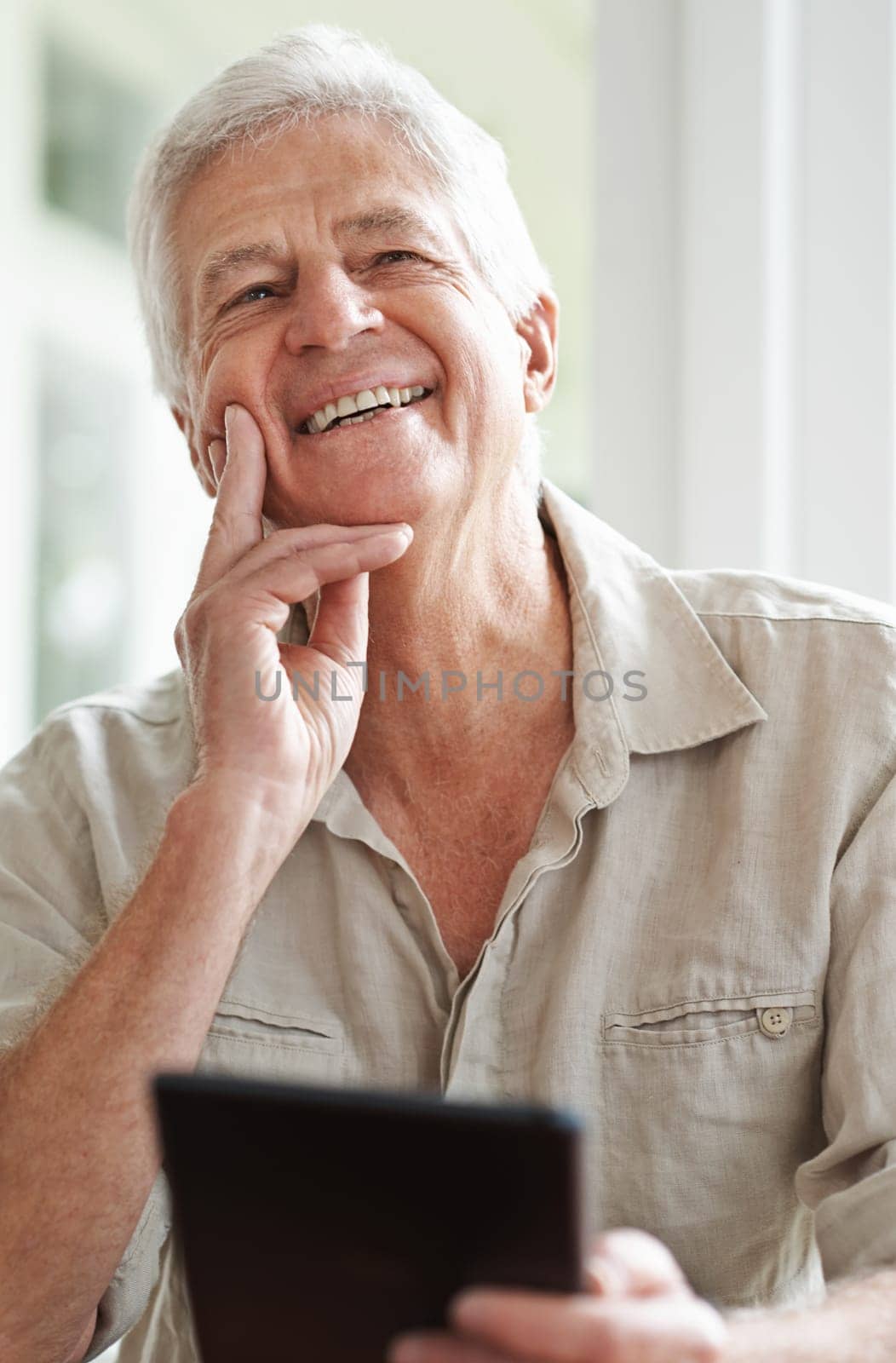 Senior man, tablet and laugh for thought in home, comedy and streaming comic on social media. Elderly male person, funny internet blog and thinking on memory to relax, happy and online in retirement by YuriArcurs