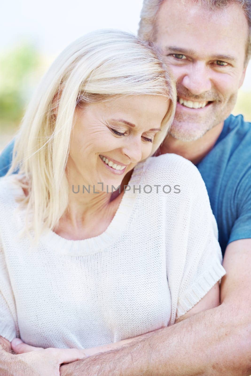 Portrait, hug and senior couple in park for bonding, relationship and commitment outdoors on weekend. Love, retirement and mature man and woman embrace for romance, relaxing and marriage in nature.