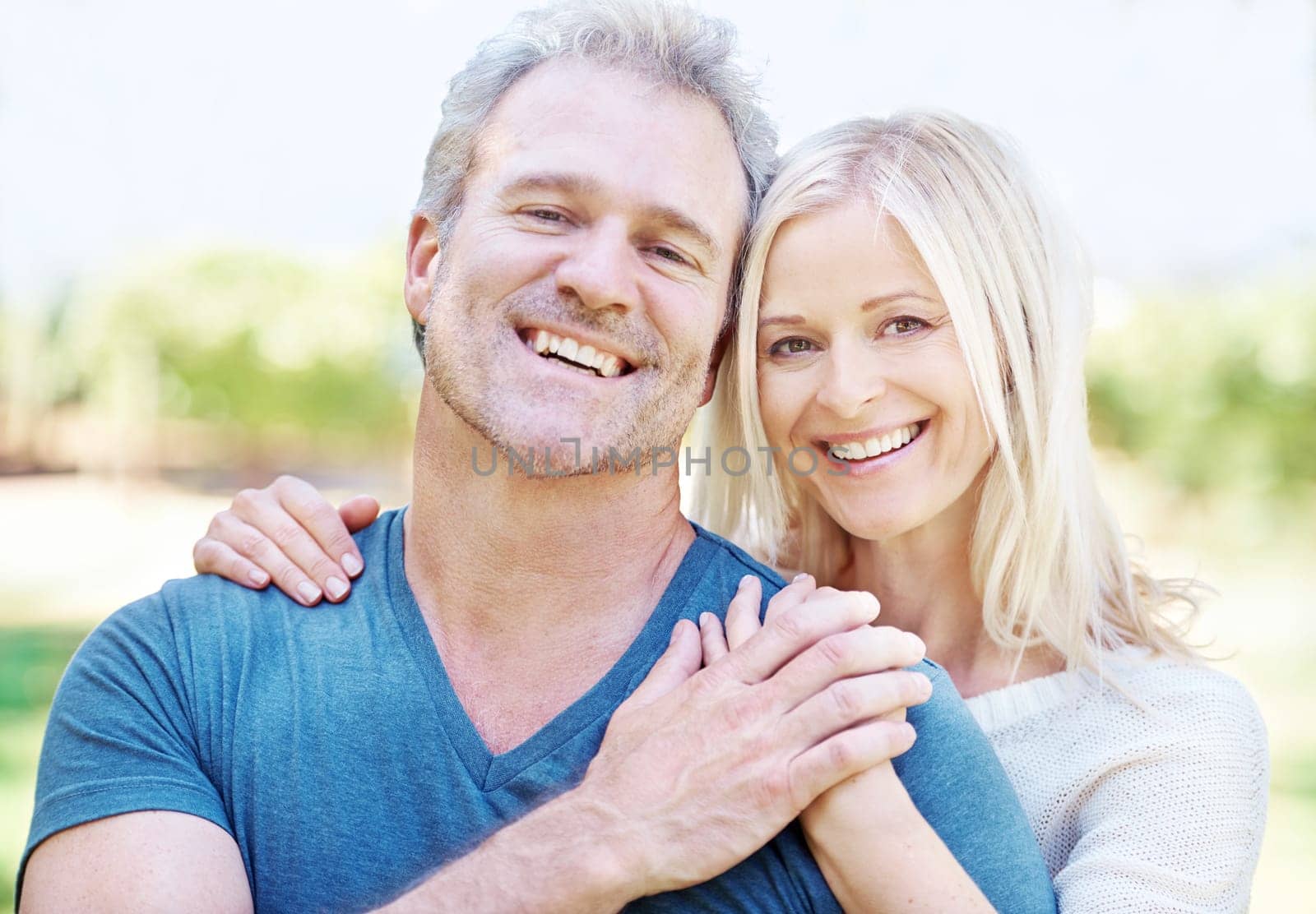 Mature, couple and portrait smile in garden for travel vacation or laughing, funny or connection. Man, woman and face or countryside forest for New Zealand holiday with humor, together or support.