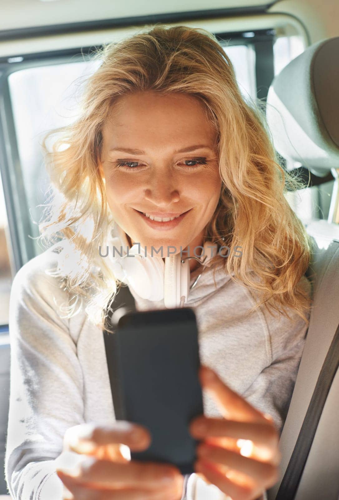 Woman, selfie and phone in car, smile and road trip for memories, social media and post. Excited, technology and travel or internet, picture and livestream for communication, happy and mobile app by YuriArcurs