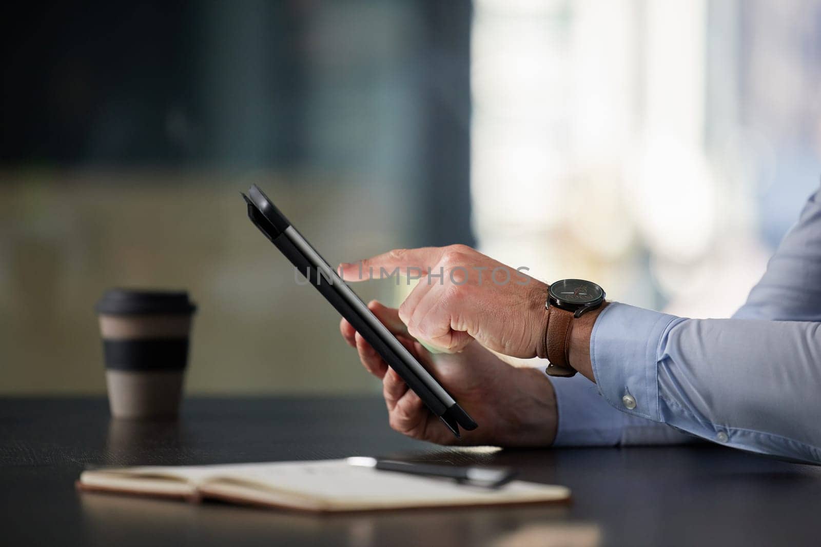 Businessman, tablet and hands in office typing for communication, corporate research and blog post. Male person, tech or notebook on desk working on online plan for website, social media or sales by YuriArcurs