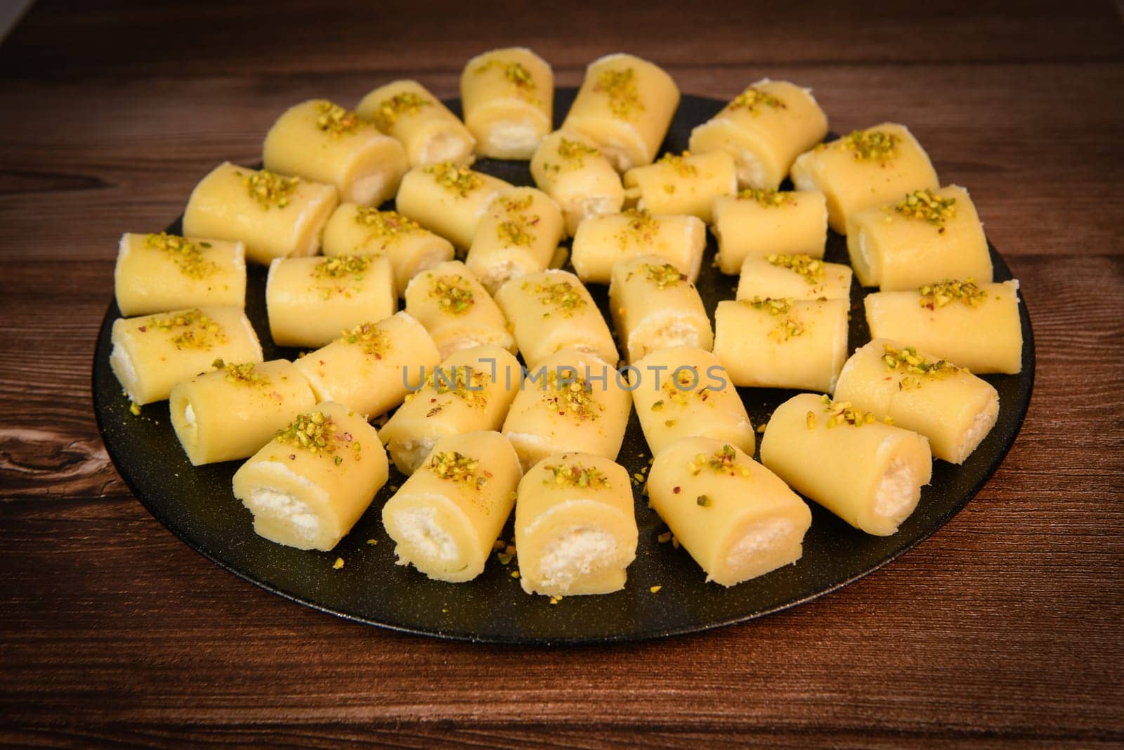 LEBANESE PASTRY RECIPE, ORIENTAL FOOD, HALAWET AL JEBEN, MOZARELLA, ASHTA AND FINE SEMOLINA. High quality photo