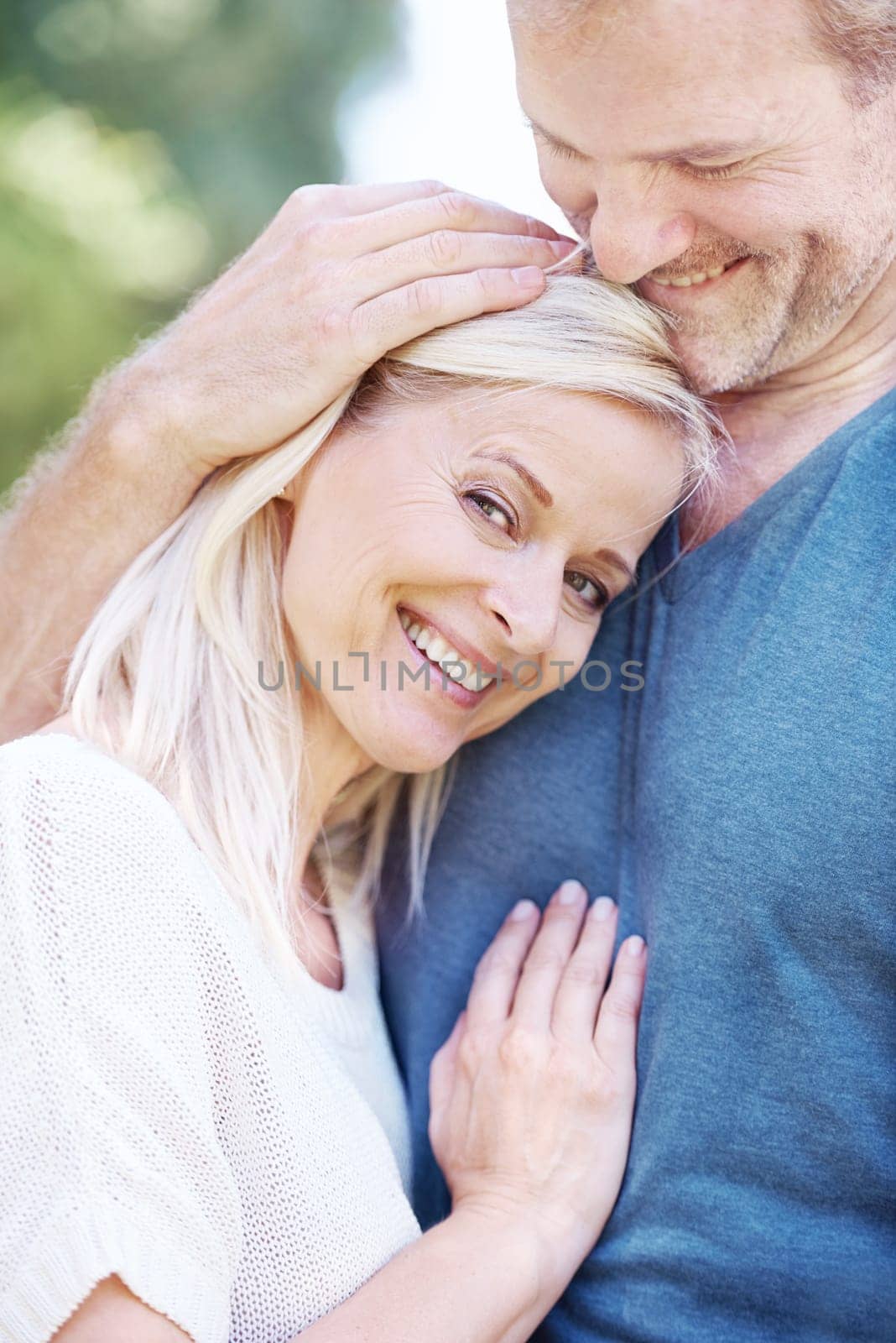 Happy, hug and portrait of mature couple in park for bonding, relationship and commitment on weekend. Love, retirement and senior man and woman embrace for romance, relaxing and marriage in nature by YuriArcurs