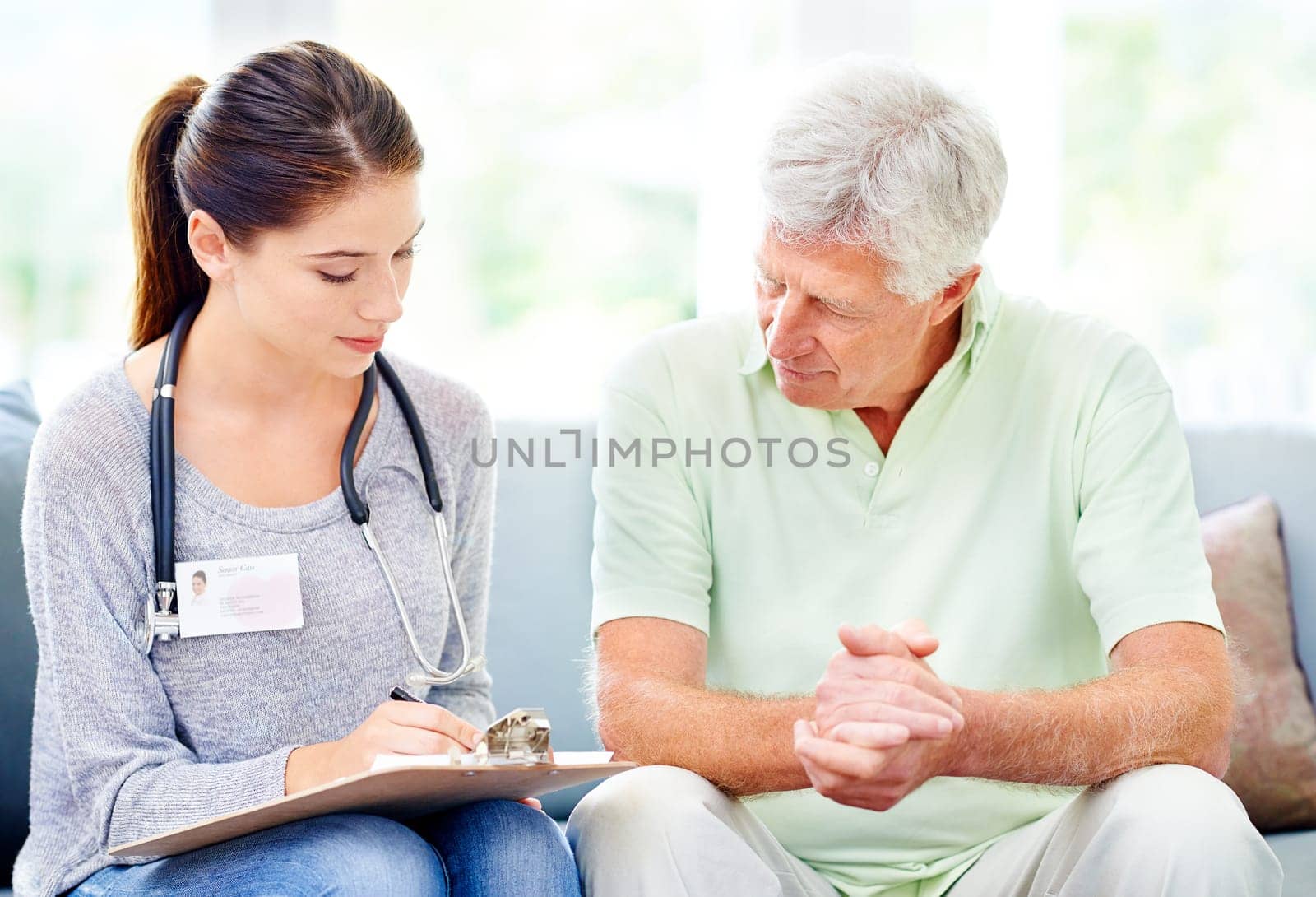 Results, consultation and senior man with doctor in home to check health with advice for hypertension. Healthy, patient and caregiver in elderly care with info, support or notes on blood pressure.