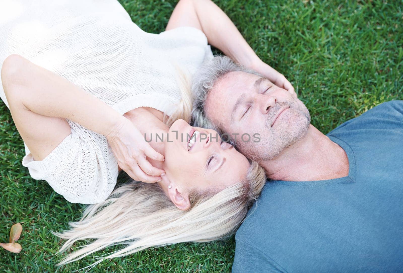 Mature, couple and peace on grass or married connection for travel holiday on anniversary, date or bonding. Man, woman and from above or backyard garden in Australia for marriage, summer or resting.