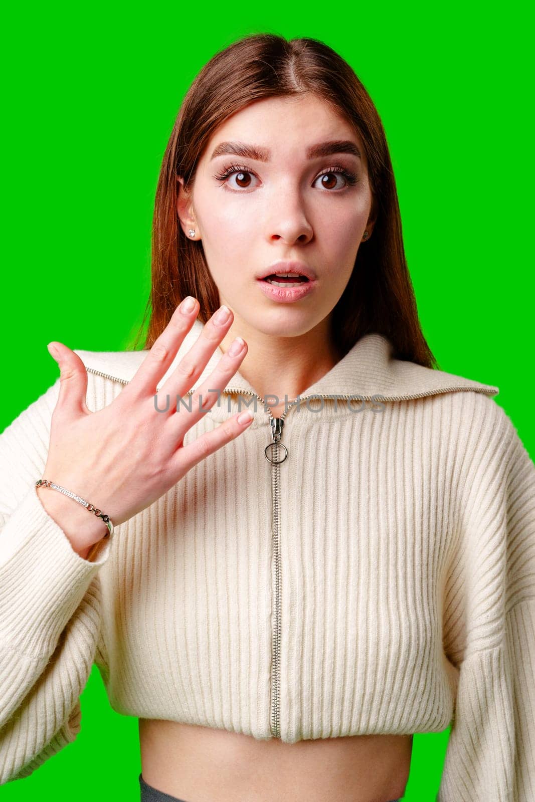 A woman wearing a white sweater is gesturing with her hand, possibly expressing emotion or emphasizing a point. by Fabrikasimf