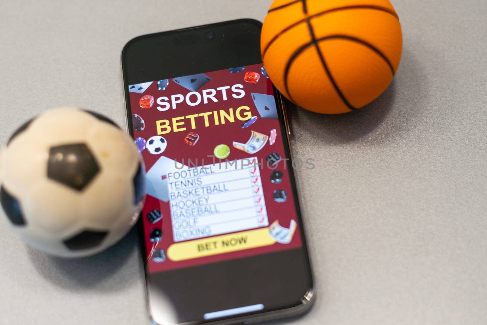 smartphone with application for sport bets and a basketball ball, concept of online bets by Andelov13