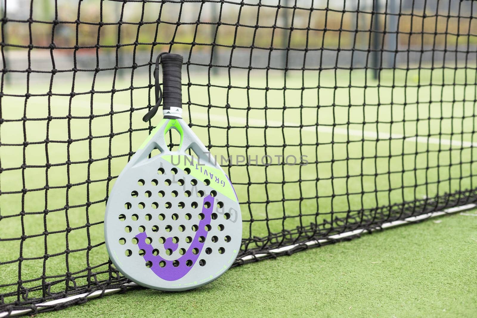 Ukraine Kyiv, April 13 2024. Paddle tennis racket and ball. High quality photo